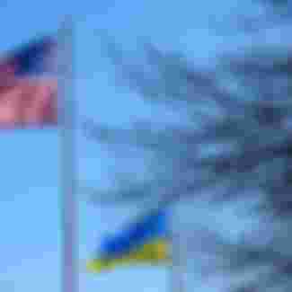 The flags of the United States and Ukraine flying side by side.