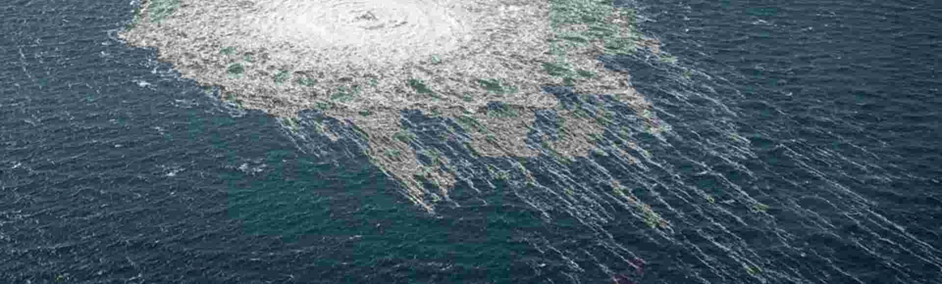 Gas from the ruptured Nord Stream 2 pipeline bubbles to the surface of the Baltic, seen from a Danish F-16 on 27 September 2022.
