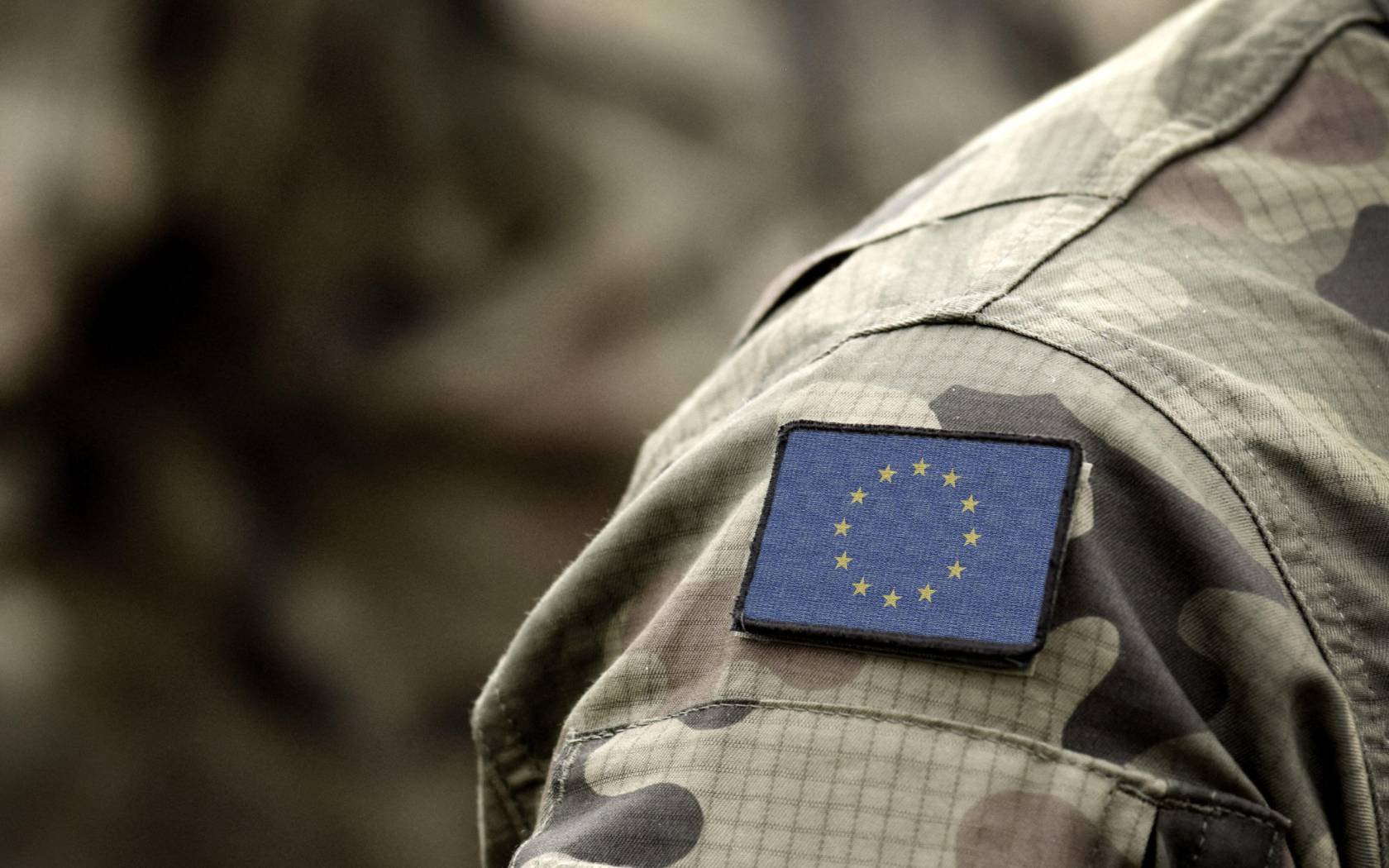 The EU flag on a military uniform.