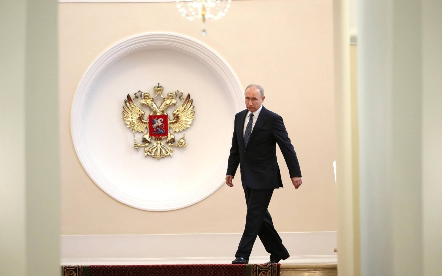 Russian President Vladimir Putin walks through the halls of the Kremlin on his way to be sworn in as the President of the Russian Federation on May 7, 2018 in Moscow.