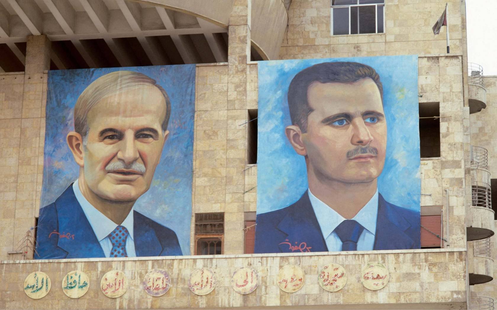 Giant portraits of Hafiz and Bashar al-Assad by the Hamidiye Souq in Damascus, prior to 2011.