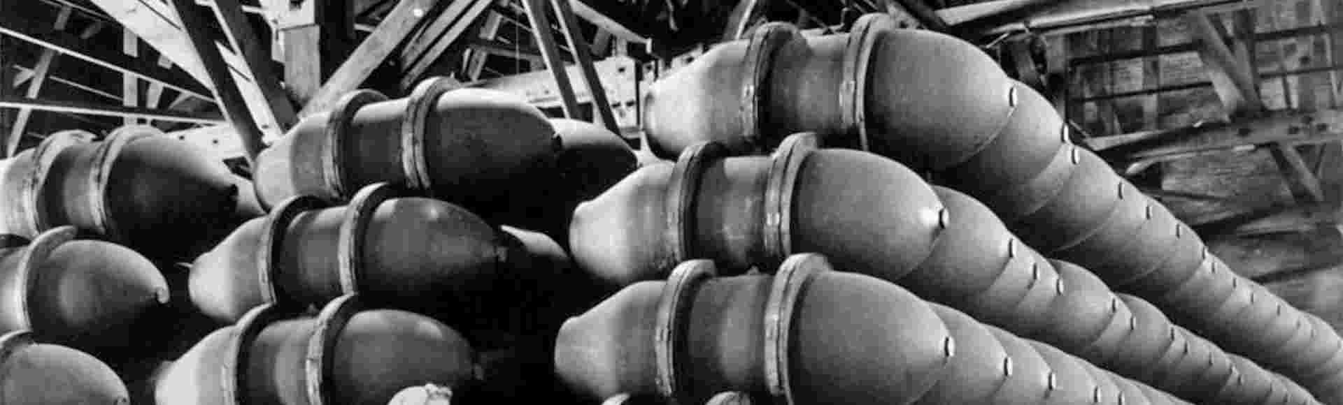 A worker at the US Army Nebraska Ordnance Plant in Omaha, Nebraska, with 1000 lb bomb cases in May 1943.