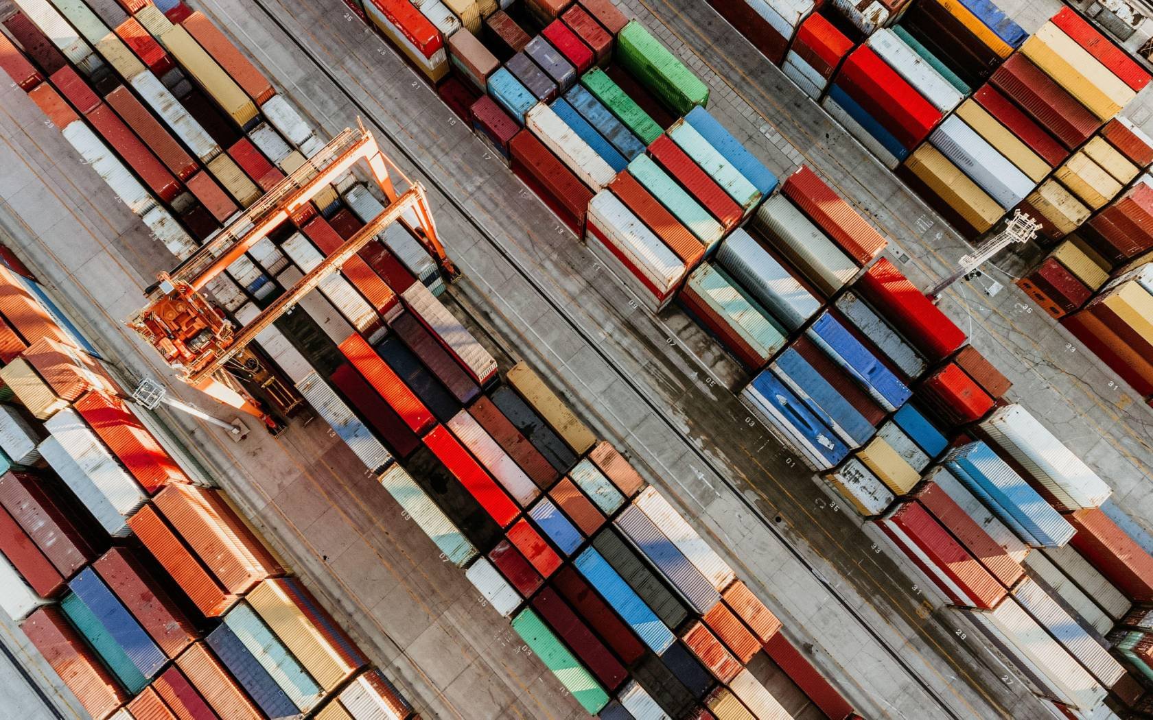 Aerial view of shipping container port terminal.