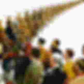 English propaganda poster from the First World War showing a column of soldiers and civilians marching to war.