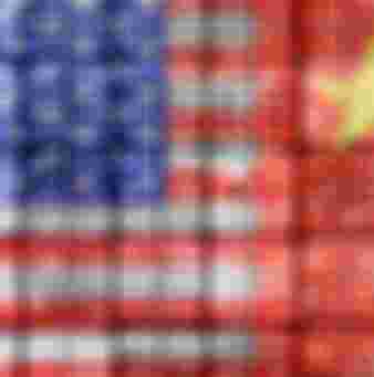 The US and Chinese flags on stacked containers.