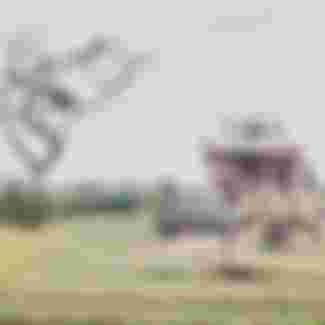 An American soldier passes the ruins of a temple in Hue, Vietnam, 1968. Credit: Bettmann Archive / Getty Images.
