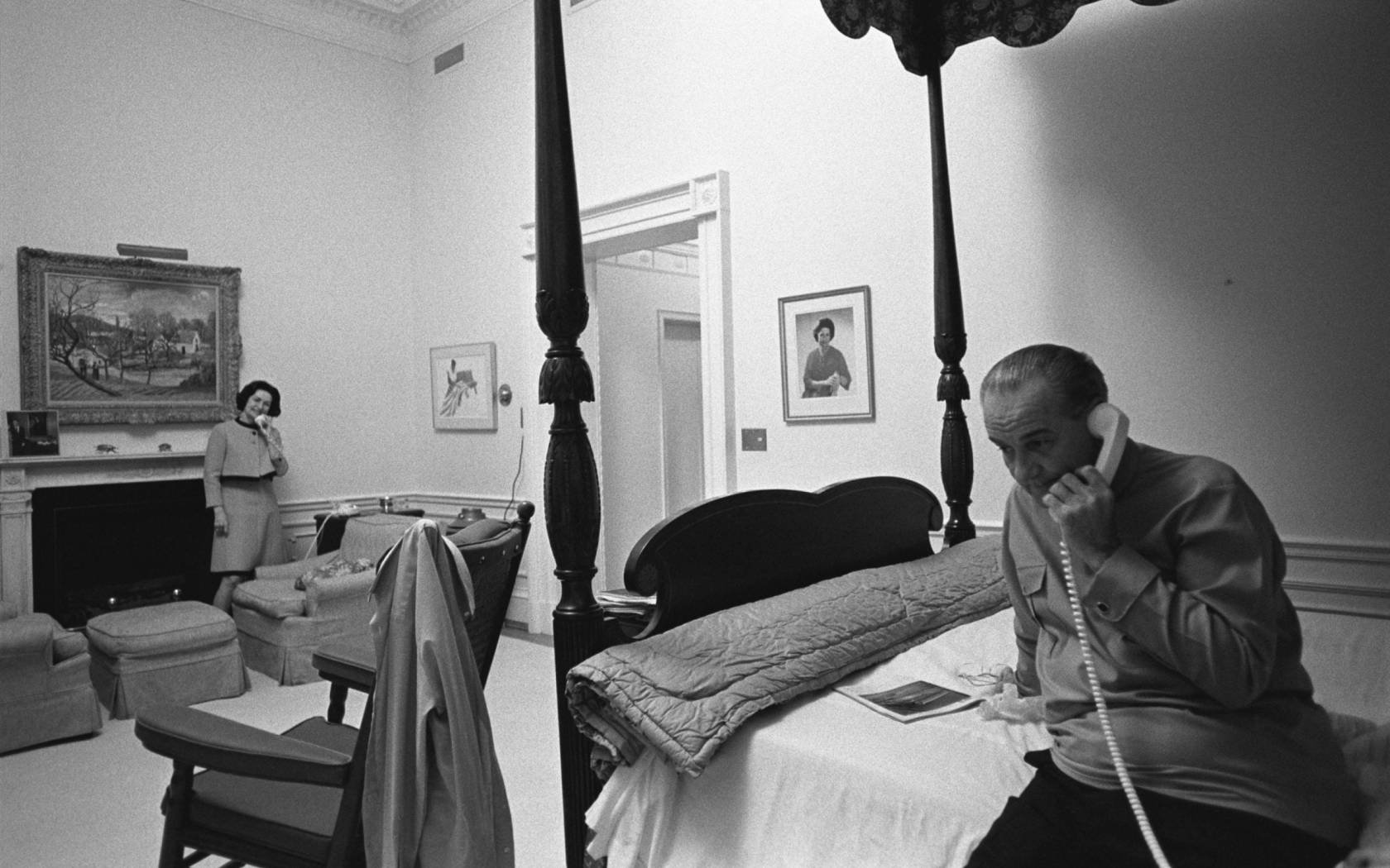 Lady Bird and Lyndon Johnson taking phone calls in their White House bedroom after he announced his withdrawal from the 1968 election.
