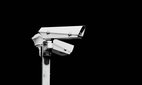 Two surveillance cameras isolated on black background.