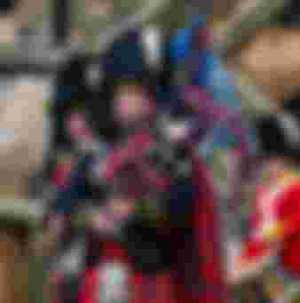 Royal Scots Guards military pipers playing bagpipes in kilt uniforms at Edinburgh Castle in a military ceremony, Scotland, UK.