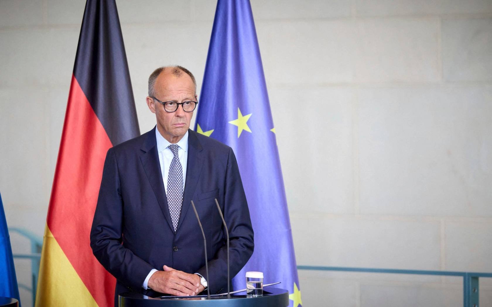 German Chancellor Friedrich Merz, listens to a question during a joint press conference with Ukrainian President Volodymyr Zelenskyy, in Berlin, Germany, 13 August 2025.