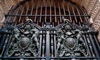 Heraldic gates at an entrance to the Foreign, Commonwealth and Development Office in Whitehall. London, United Kingdom.
