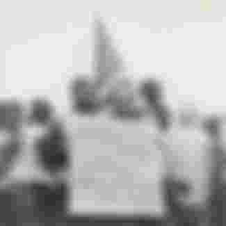 A member of the American Jewish Congress participating in the 1965 Montgomery March, advocating for civil rights.