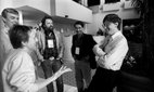 John Perry Barlow (centre, with beard) speaks with Bill Gates at the Annual PC Forum, 1991.
