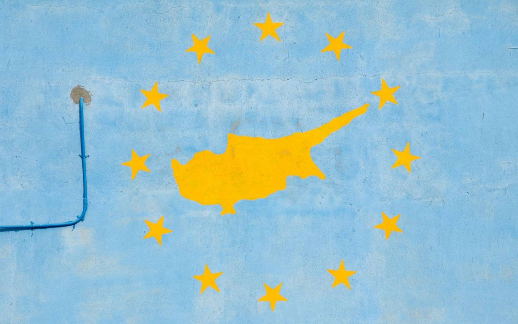 A community building in Protaras on the Eastern Mediterranean island of Cyprus shows a silhouette of the island within the stars of the EU flag.