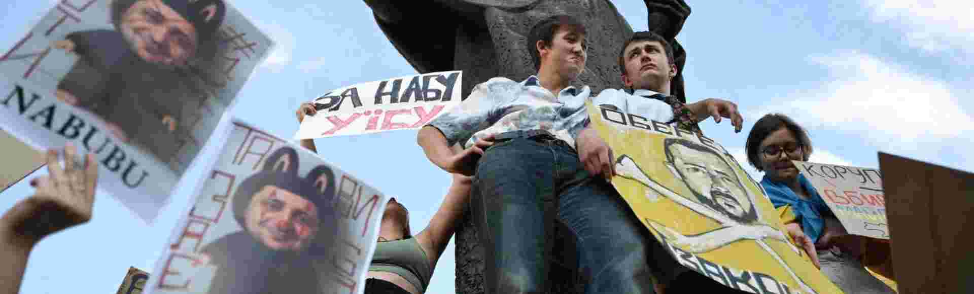 Demonstrators stay at the Taras Shevchenko monument to protest against draft law N12414 adopted on July 22, which reduces the powers of the National Anti-Corruption Bureau (NABU) and the Specialised Anti-Corruption Prosecutor’s Office (SAPO), Lviv, Ukraine, July 23, 2025.