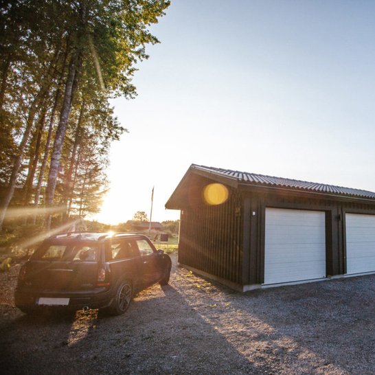 Garage with Mini Cooper beside