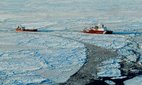 The US Coast Guard performs icebreaking operations in the Bering Sea.