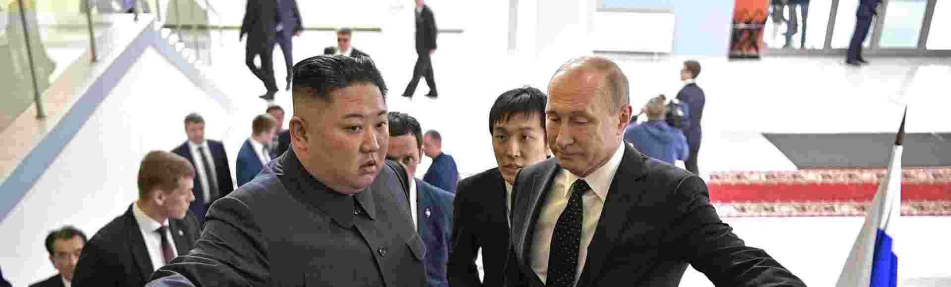 Vladimir Putin, right, with North Korean leader Kim Jong-Un on an escalator together after arriving for bilateral discussions on April 25, 2019 in Vladivostok, Russia.