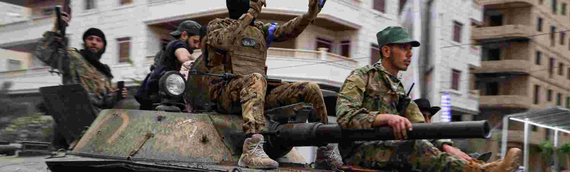 Members of Syria's security forces deploy in the town of Sahnaya.