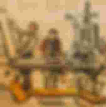 Nineteenth century typesetter and printers working with Stanhope cast iron printing press in print shop. Credit: Arterra Picture Library / Alamy Stock Photo