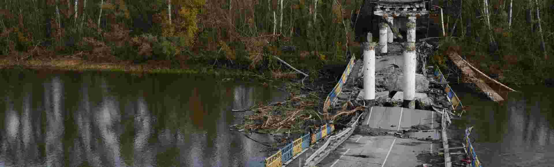 A destroyed bridge crossing the Siverskyi Donets river.