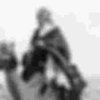 Thomas Edward (of Arabia) Lawrence riding a camel