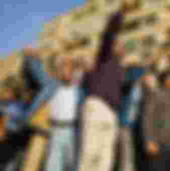 Anti-government protesters celebrate on a tank in Tahrir Square, Cairo, on the first full day of the square's occupation in January 2011.