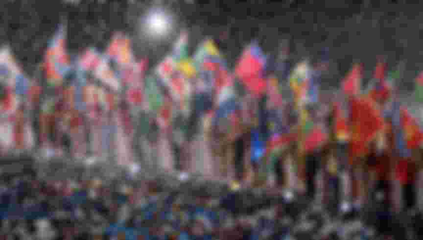 Athletes with flags from all nations make their way into the stadium as part of the 2012 London Olympic Summer Games. Credit: AMA/Corbis via Getty Images
