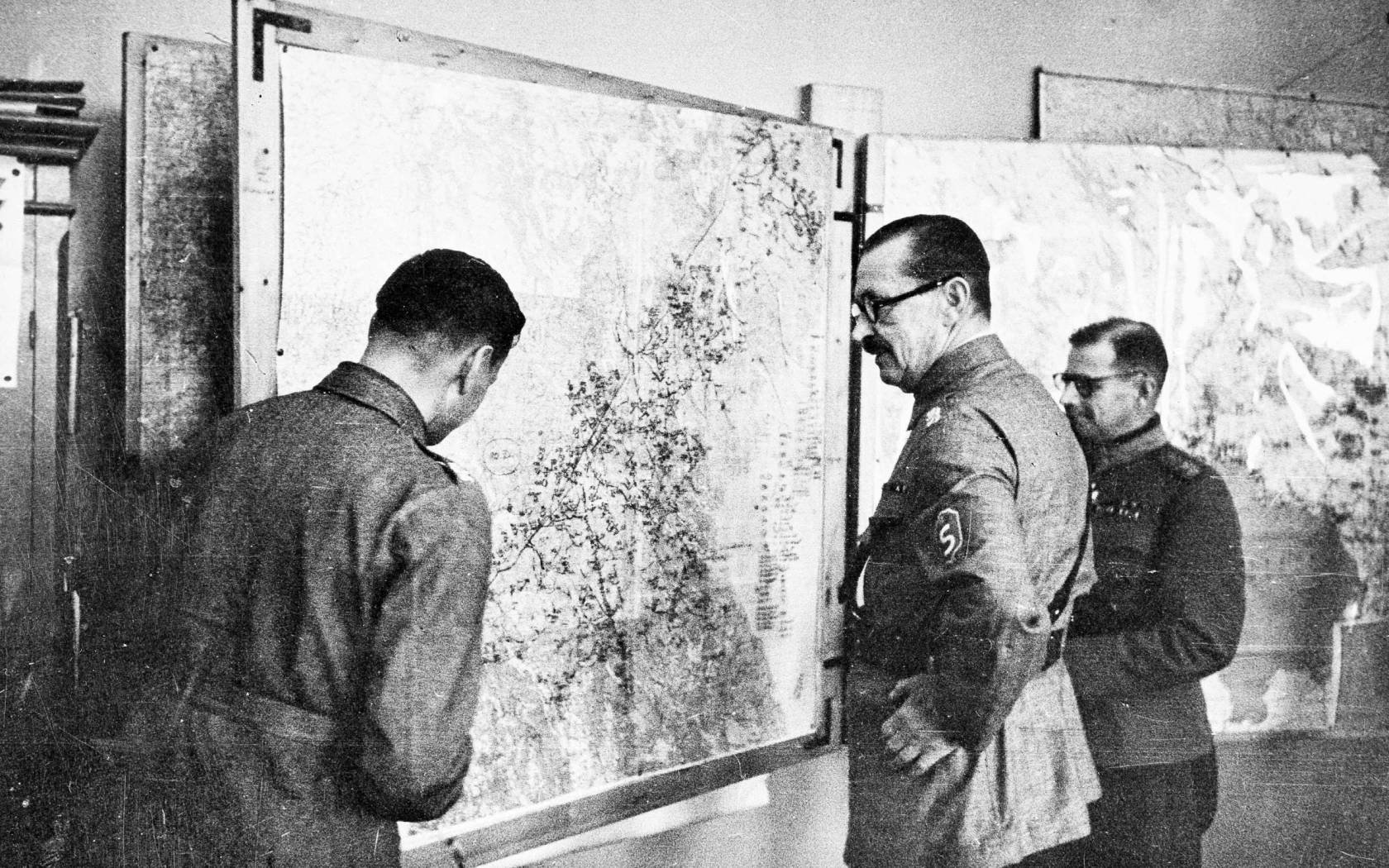 Field Marshal Carl Gustaf Mannerheim, centre, discusses strategy against the Russians at his field headquarters on the Finnish-Russian border, April 1942.
