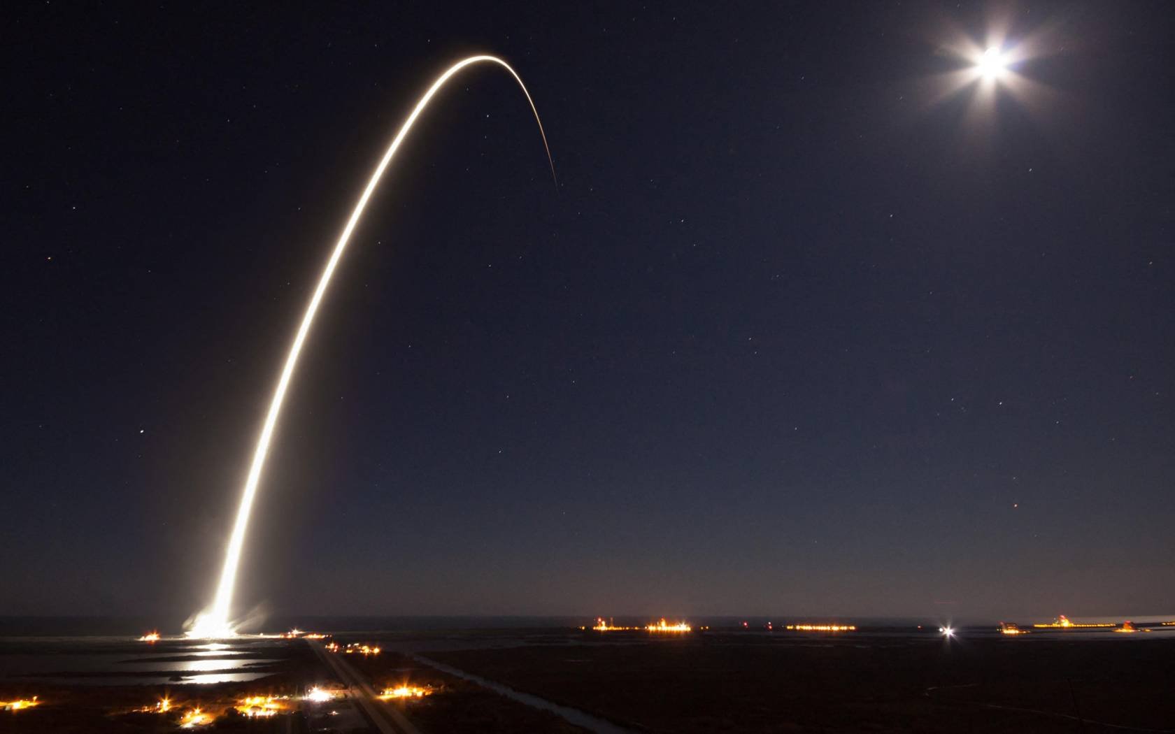 The SpaceX Falcon 9 rocket streaks across the night sky.