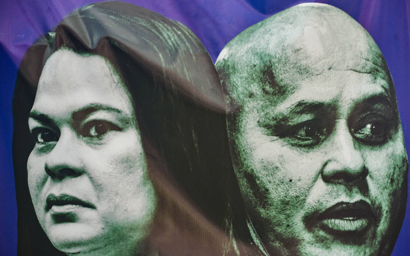 Protesters hold placards during a demonstration on the first day of Philippine Vice President Sara Duterte's impeachment, in Manila, on May 18, 2026.