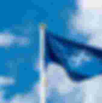 NATO flag waving in the wind.