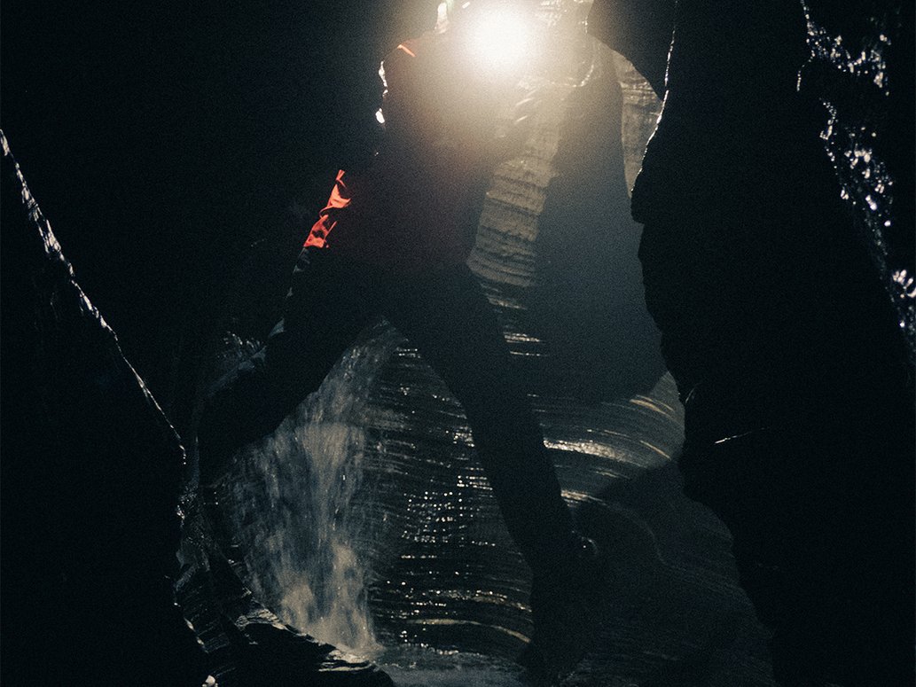 a person climbing inside the Kåppasjokk Caves