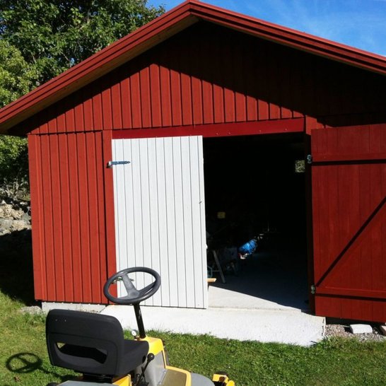 Classic red barn with white door