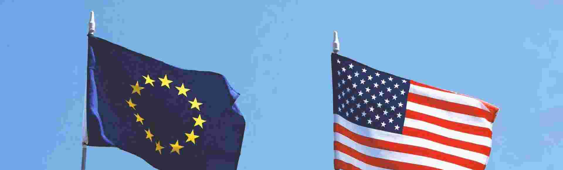 The flags of the European Union and the United States of America flying next to each other.