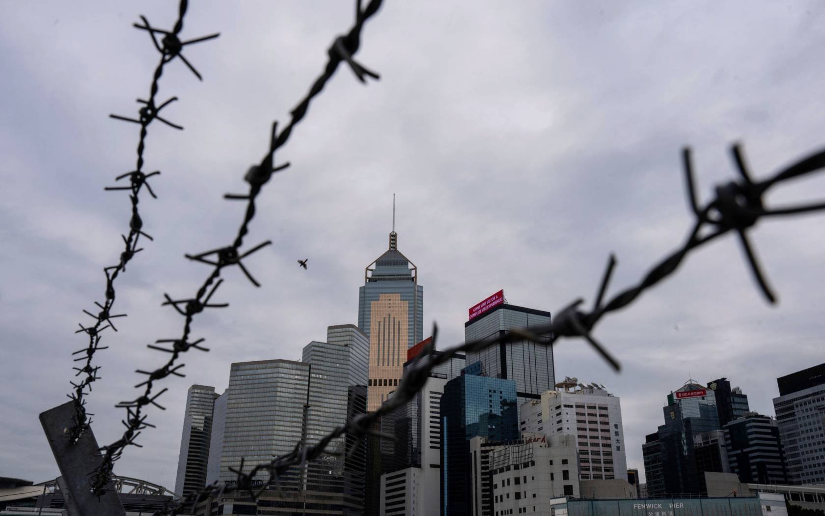 Hong Kong viewed through barbed wire.