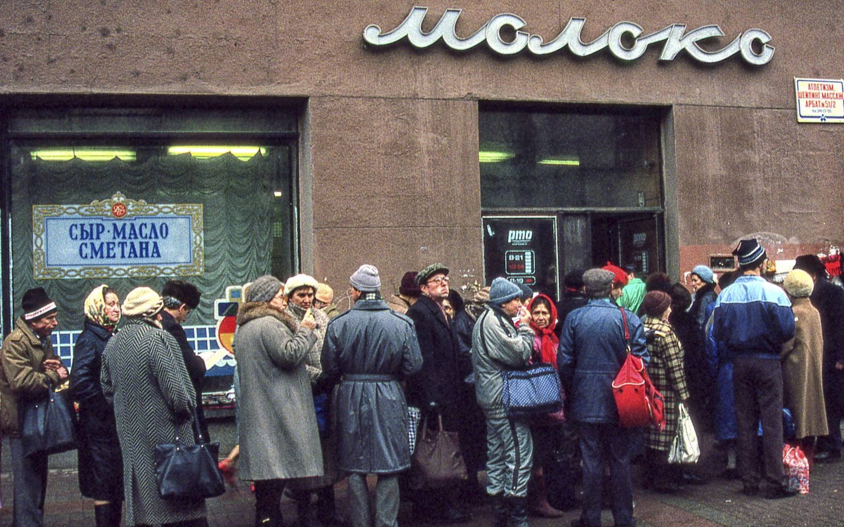 Muscovites queue up outside a shop selling milk and dairy products in Moscow during difficult economic times just before the dissolution of the USSR.