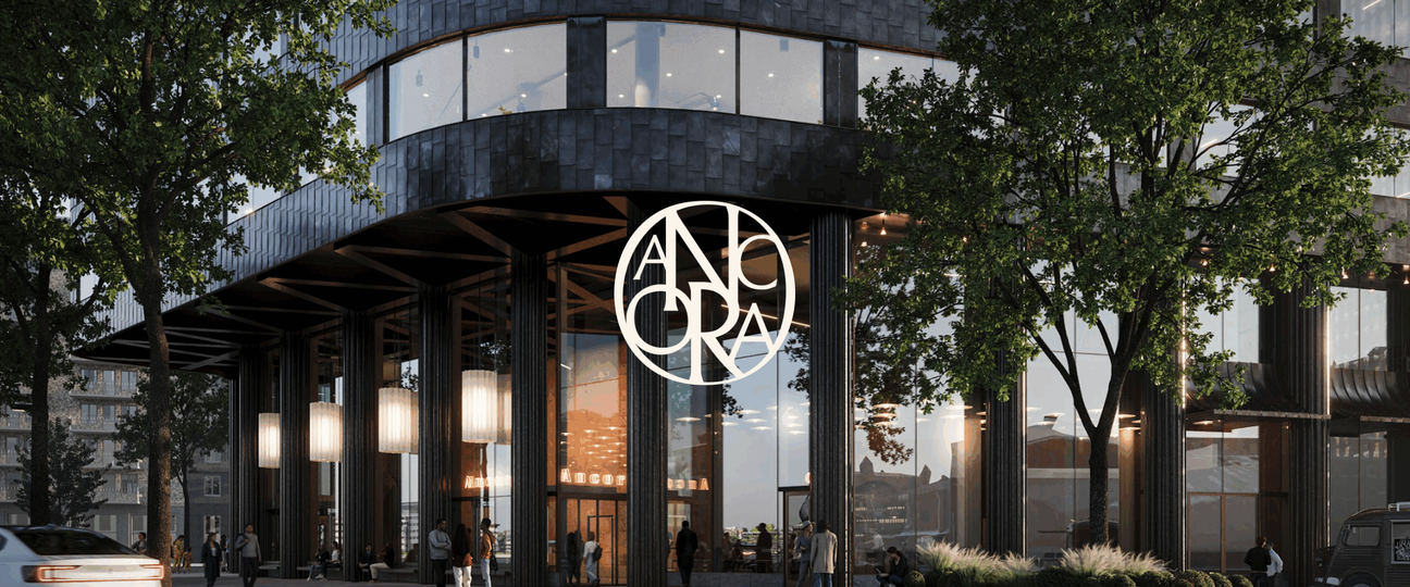 Fasadvy av kontorshuset Ancora med monogram.