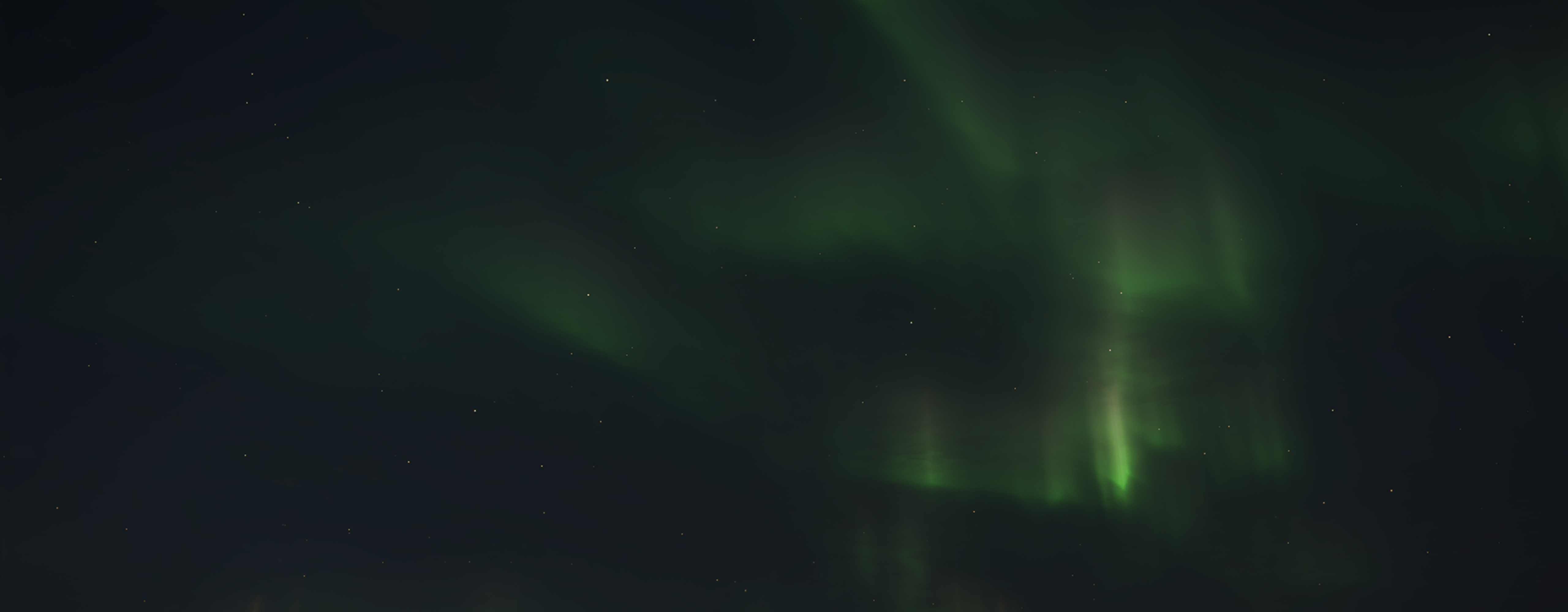Showcasing the Northern Lights appearing across the starry skies of Revontuli Coast.