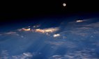 The Moon rising over Western China.