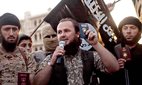 Undated propaganda video released by the Islamic State of Iraq and the Levant showing a group of foreign ISIS fighters holding up their passports as they pledge allegiance to the caliphate in Anbar Province, Iraq.