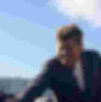 During a campaign trip Senator John F. Kennedy greets a roadside crowd in Indiana.