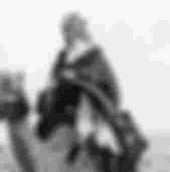 Thomas Edward (of Arabia) Lawrence riding a camel