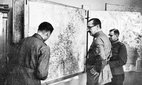 Field Marshal Carl Gustaf Mannerheim, centre, discusses strategy against the Russians at his field headquarters on the Finnish-Russian border, April 1942.