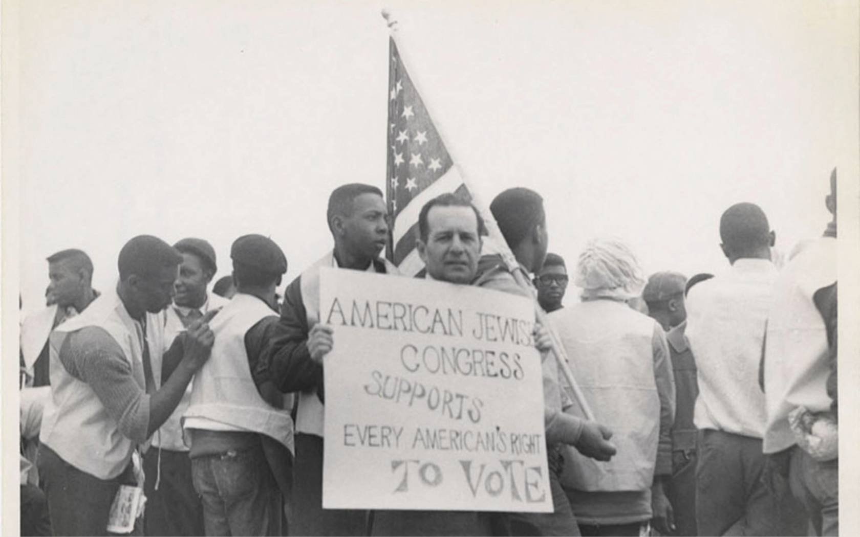 A member of the American Jewish Congress participating in the 1965 Montgomery March, advocating for civil rights.