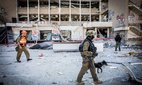 Israeli first responders at a site of an Iranian ballistic missile strike in Haifa.