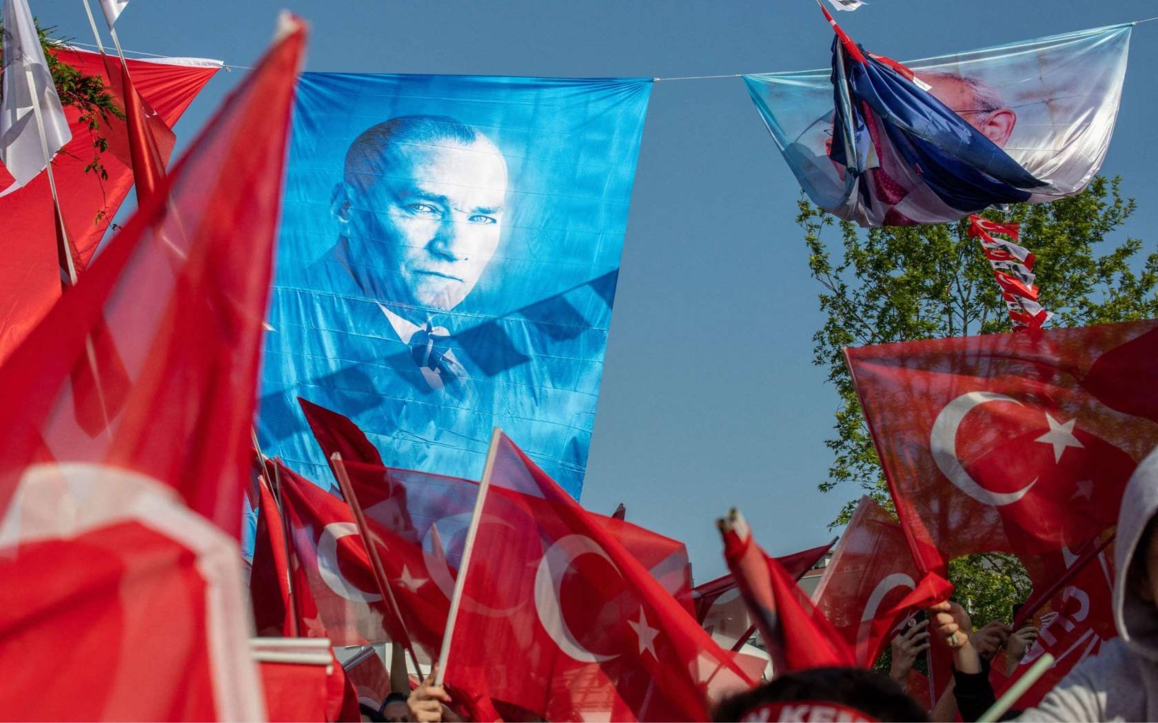 Republican People's Party (CHP) supporters waving an Atatürk flag at an Ekrem Imamoglu rally held in Istanbul on 25 May 2023.