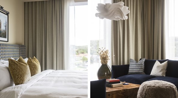 Säng och del av soffgrupp i stora sviten