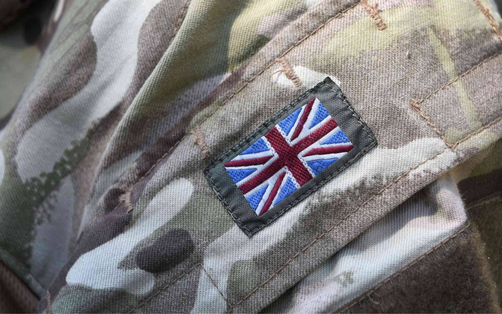 A British flag on a soldier's uniform.