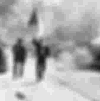 Czechoslovaks carry their national flag past a burning Soviet tank in Prague, 1968. The JIC failed to foresee Soviet retaliations to the mass protests